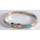 A SILVER AND TURQUOISE BUCKLE BRACELET.