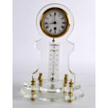 AN UNUSUAL EARLY 20TH CENTURY FRENCH CLEAR GLASS MANTEL CLOCK with brass bound dial. 8.25ins high.