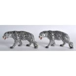 A PAIR OF STAFFORDSHIRE FIGURES OF SPOTTED LEOPARDS modelled in roaming stances. 6.5ins wide.