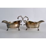 A PAIR OF GEORGE III ENGLISH SILVER SAUCEBOATS. 9.5oz. 6.25ins wide.
