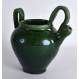 AN UNUSUAL GREEN GLAZED POTTERY JUG Attributed to Farnham Pottery, with high loop handle. 6Ins