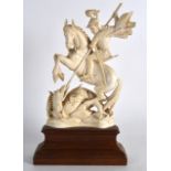 A 19TH CENTURY CARVED IVORY FIGURE OF ST GEORGE AND THE DRAGON modelled upon a carved wood plinth.