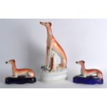 A LARGE 19TH CENTURY STAFFORDSHIRE FIGURE OF A HOUND modelled beside a hare, together with a pair of