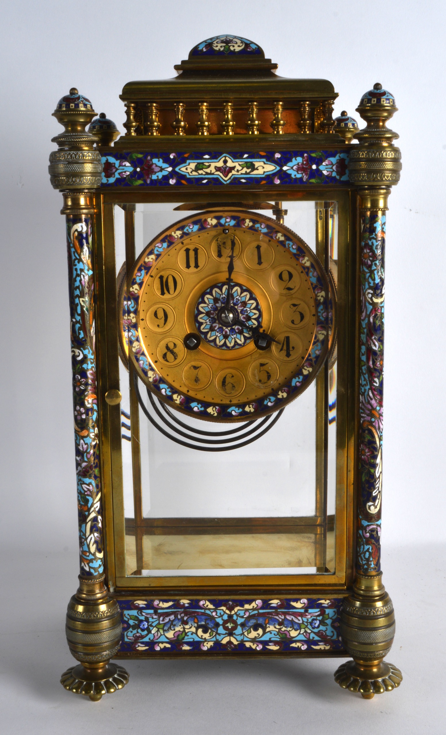 A GOOD 19TH CENTURY FRENCH BRONZE AND CHAMPLEVE ENAMEL MANTEL CLOCK with four cylindrical pillars