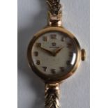 A 9CT GOLD LADIES OMEGA WRISTWATCH. 17.5grams.