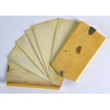 A MID 19TH CENTURY CARVED IVORY NOTEPAD with white metal mounts and several ivory slides. 4Ins