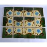 AN ART NOUVEAU ENGLISH TWELVE PIECE SET OF TILES decorated with stylised flowers. Each 6ins