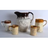 FIVE ASSORTED SALT GLAZED ANTIQUE HUNTING JUGS AND TANKARDS. Largest 10.25ins high. (5)