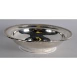 AN EARLY 20TH CENTURY CONTINENTAL SILVER BOWL with reeded border. 1.25oz. 6Ins diameter.