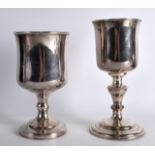 A MID 19TH CENTURY RELIGIOUS TYPE GOBLET with another similar chalice. 8Ins & 8.75ins high. (2)