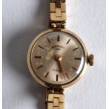 A ROTARY 9CT GOLD LADIES WRISTWATCH with original box and papers. 16.9grams.