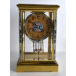 A LATE 19TH CENTURY FRENCH CHAMPLEVE ENAMEL AND BRONZE FOUR GLASS MANTEL CLOCK with foliate