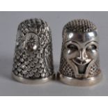 TWO NOVELTY SILVER THIMBLES. (2)