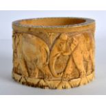 AN EARLY 20TH CENTURY AFRICAN CARVED IVORY RING C1910 decorated all around with elephants. 3.25ins