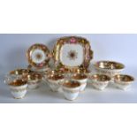 AN EARLY 19TH CENTURY ENGLISH PORCELAIN TEASET painted with flowers upon a richly embellished gilt