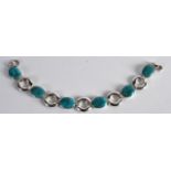 A HIMALAYAN SILVER AND TURQUOISE BRACELET.