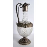 A GOOD 19TH CENTURY RUSSIAN SILVER MOUNTED CRYSTAL CLARET JUG bearing a central band of monograms.