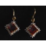 A PAIR OF 9CT GOLD FIRE TOPAZ AND DIAMOND DROP EARRINGS.