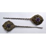 A PAIR OF 19TH CENTURY CONTINENTAL SILVER AND GEM SET HAIR PINS of large proportions.