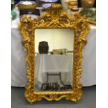 AN 18TH/19TH CENTURY CARVED FLORENTINE MIRROR. 3 ft 5ins x 2 ft 5ins.