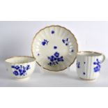 AN 18TH CENTURY WORCESTER COFFEE CUP, TEABOWL AND SAUCER painted in dry blue with flowers. (3)