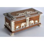 A FINE 19TH CENTURY INDIAN CARVED IVORY AND SANDALWOOD CASKET decorated with figure on horses,