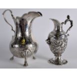 A MID 19TH CENTURY FRENCH SILVER CREAM JUG together with another Continental silver cream jug. 12.