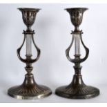 A VERY UNUSUAL PAIR OF ENGLISH SILVER CANDLESTICKS of lyre shape with oval bases. Sheffield 1916.
