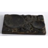 A CHINESE CARVED HARDSTONE BRUSH WASHER depicting stylised kylin. 3.5ins wide.