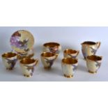 A STYLISH SET OF CARLTONWARE CUPS AND SAUCERS decorated with birds on a mottled ground. (14)