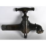 AN UNUSUAL 19TH CENTURY ITALIAN BRONZE FOUNTAIN TAP with mythical head terminal. 9.5ins wide.