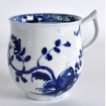 AN 18TH CENTURY WORCESTER WISHBONE HANDLED COFFEE CUP of bell shape, painted with a rock and