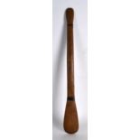 A SMALL EARLY 20TH CENTURY AFRICAN CARVED HARDWOOD PADDLE of small proportions. 2Ft 1ins long.