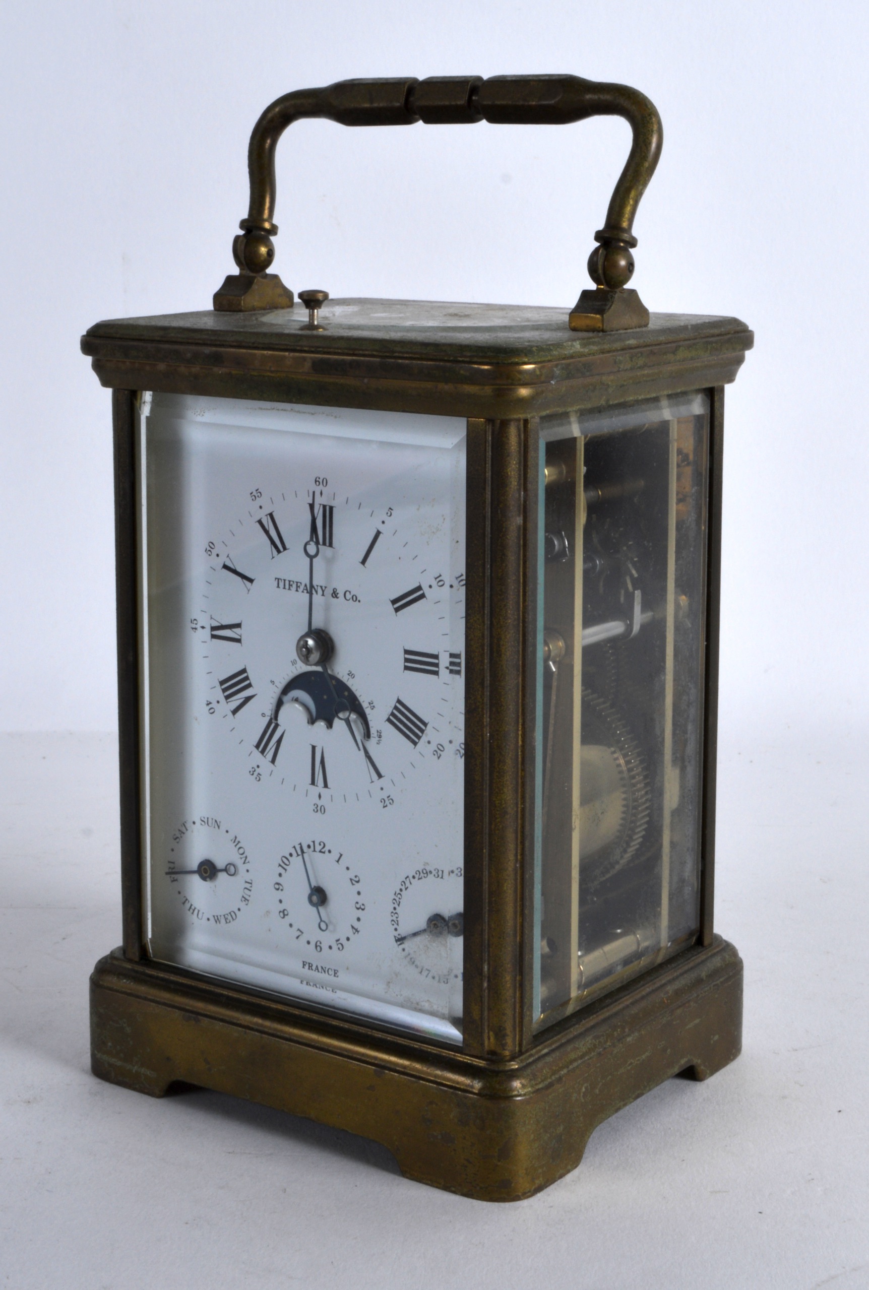 AN EARLY 20TH CENTURY FRENCH BRASS REPEATER CARRIAGE CLOCK retailed by Tiffany & Co, with moon