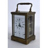 AN EARLY 20TH CENTURY FRENCH BRASS REPEATER CARRIAGE CLOCK retailed by Tiffany & Co, with moon