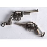 A PAIR OF MINIATURE SILVER PISTOLS.