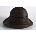 AN EARLY 20TH CENTURY CARVED WOOD NOVELTY INKWELL in the form of a Bavarian hat. 4.25ins wide.