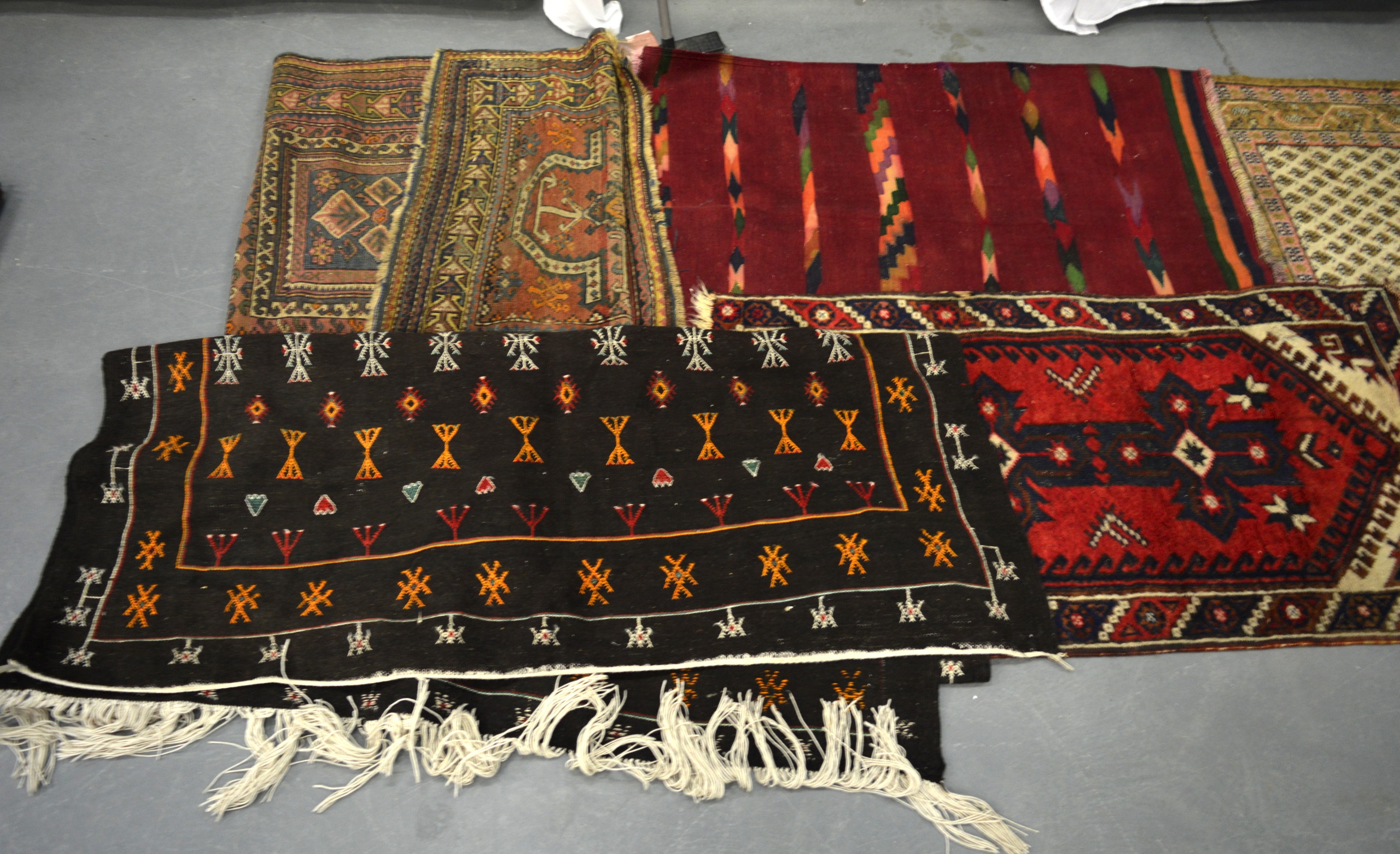 A GROUP OF FIVE RUGS, of varying design.