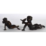 AN ART NOUVEAU BRONZE FIGURE OF A LYING CHILD holding aloft a bird, together with a similar bronze