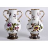 A PAIR OF LATE 19TH CENTURY PORCELAIN SILVER MOUNTED VASES painted with flowers. 2.75ins high.
