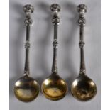 A GROUP OF THREE UNUSUAL LATE 19TH CENTURY ENGLISH HALLMARKED APOSTLE SPOONS. (3)