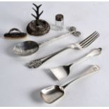 AN ARTS AND CRAFTS CONTINENTAL SILVER SPOON together with a silver ring holder, silver sewing