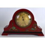 AN EARLY 20TH CENTURY CHINOISERIE 8 DAY RED MANTEL CLOCK with engine turned dial. 9.5ins wide.