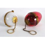 AN UNUSUAL PAIR OF LATE 19TH CENTURY FRENCH OPALINE GLASS EGGS one in the form of an etui, with gilt