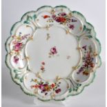 AN 18TH CENTURY CHELSEA MOULDED DISH unusually formed and painted with flowers. 9Ins diameter.