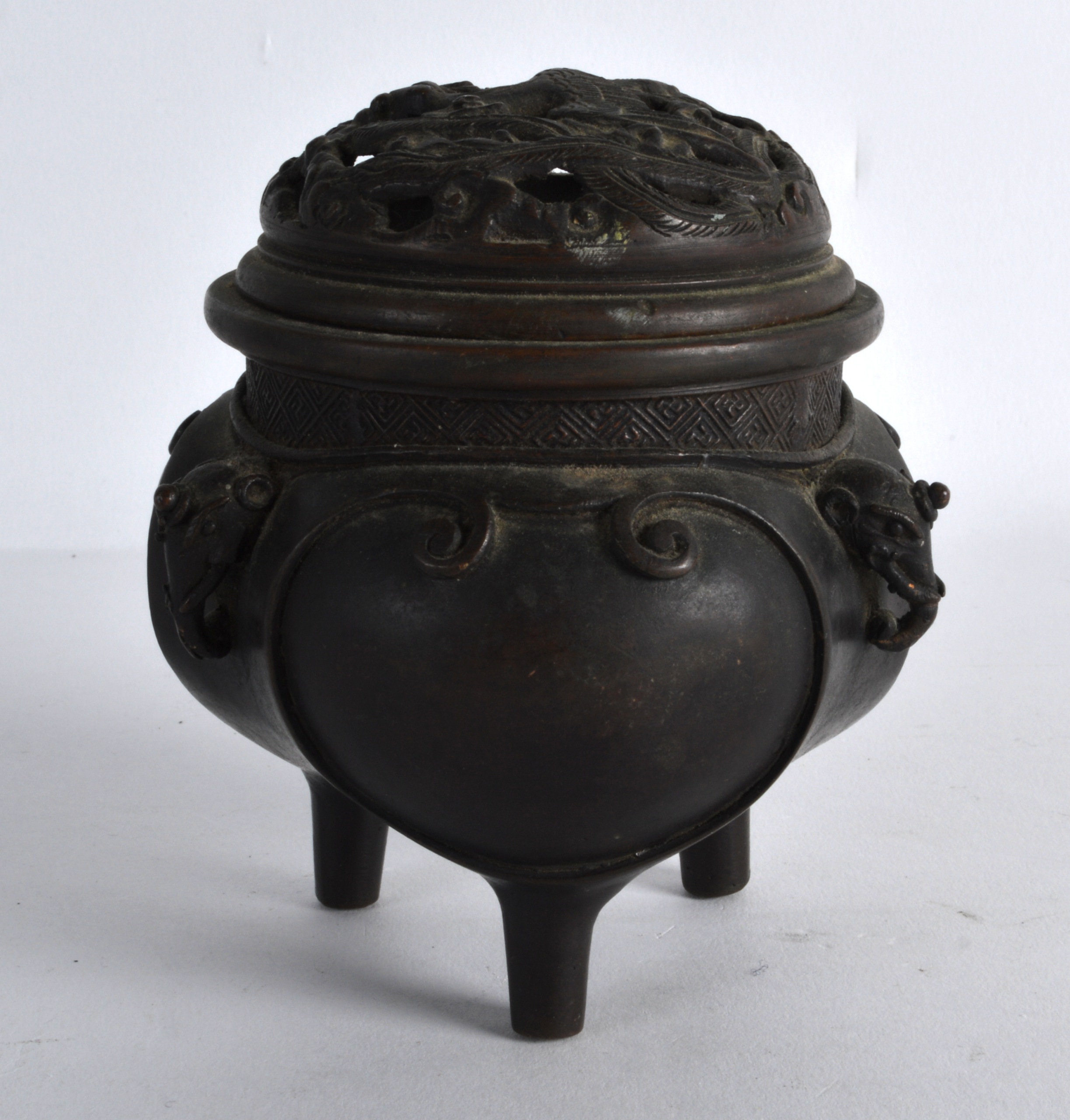 A 19TH CENTURY JAPANESE MEIJI PERIOD BRONZE CENSER AND COVER with mythical mask heads, the pierced - Image 2 of 2