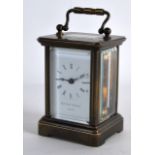 A SMALL MATTHEW NORMAN OF LONDON MINIATURE CARRIAGE CLOCK. 4.2ins high including handle.