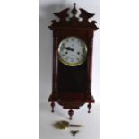 A MONTH DURATION VICTORIAN STYLE STRIKING WALL CLOCK. 2Ft 4ins high.