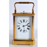 A FRENCH PETIT SONNERIE BRASS REPEATING CARRIAGE CLOCK with white enamel dial and black painted