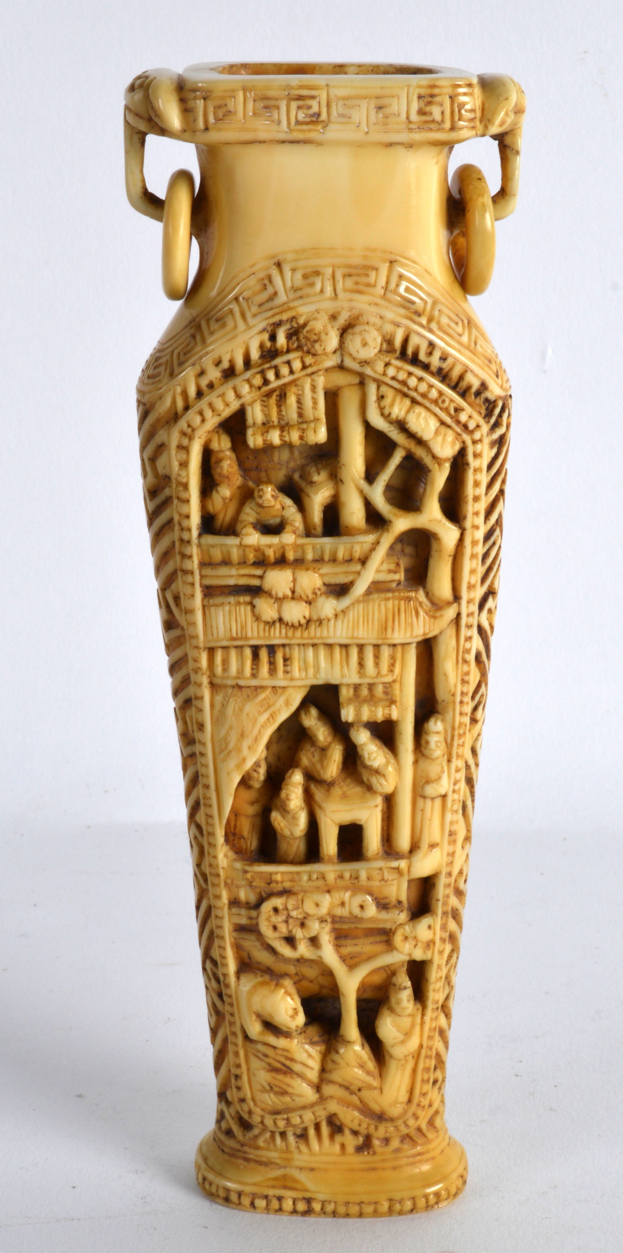 A 19TH CENTURY CHINESE CARVED CANTON IVORY TWIN HANDLED VASE formed with panels of figures in